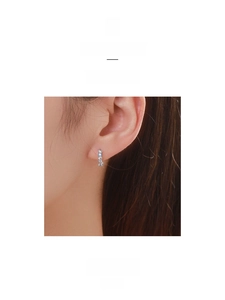 Close-up of S925 sterling silver hoop earrings with shimmering pavé zircon stones