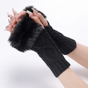 Detailed close-up of cable knit fingerless gloves with luxurious black faux fur trim