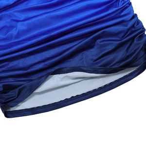 Detail of blue gradient fabric hem with ruched texture and precise stitching detail