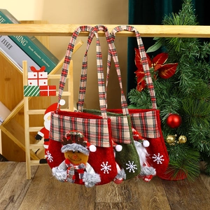Detailed view of non-woven Christmas gift bags featuring 3D Santa and Reindeer designs