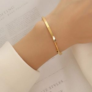 French style 18k gold plated stainless steel twisted bangle with minimalist design
