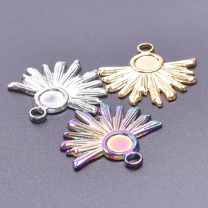 Detailed macro view of sunburst metal pendants in silver, gold, and rainbow finishes