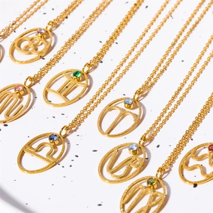 Gold zodiac necklaces with constellation symbols and colorful round turquoise pendants