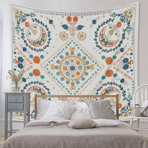 Detailed view of bohemian floral tapestry hanging on wall for cozy bedroom home decor