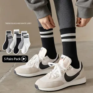 5-pack striped crew socks in black, white, and grey with knitted ribbed sports design