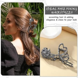 Detail of a vintage rose metal hair claw clip in gunmetal finish on a model