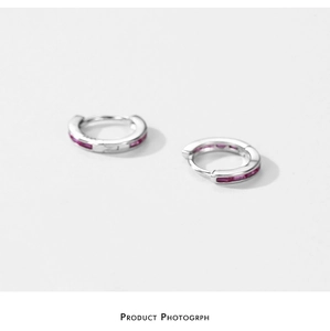 Detailed view of silver S925 sterling silver hoop earrings set with pink zircon stones