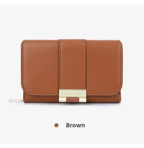 Close-up of brown pebbled leather wallet with vertical strap and gold classic metal clasp