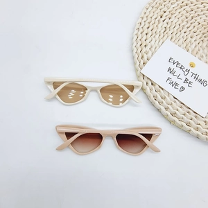 Chic retro triangle cat eye sunglasses in cream white and light coffee on a white background