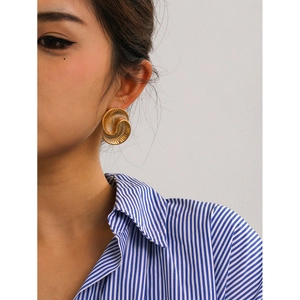 18k gold plated stainless steel spiral hoop earrings with water drop texture on model