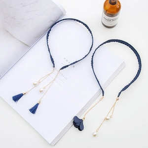 Elegant navy blue braided headband with silk tassels, pearls and fabric flower charms