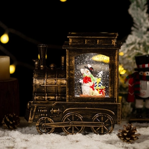 Vintage bronze Christmas snow globe train with snowman, warm LED lights and holiday music box