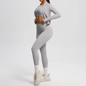 Three-piece yoga set featuring a zip-up jacket, sports bra and high-waist leggings