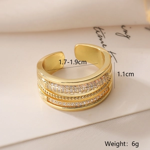 Macro detail of multilayered gold-plated ring with zircon inlay and 1.1cm width dimensions