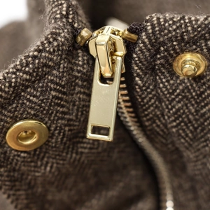 British style wool coat with golden zipper and brown herringbone fabric detail