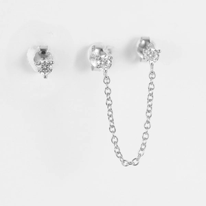 Macro view of S925 sterling silver chain earrings with prong-set cubic zirconia stones