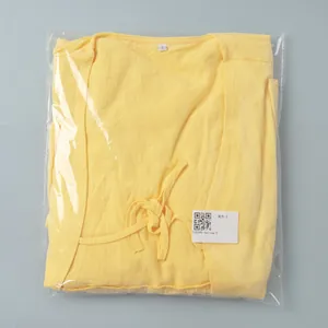 Detail of yellow V-neck skirt set in S size packaging with cotton linen texture
