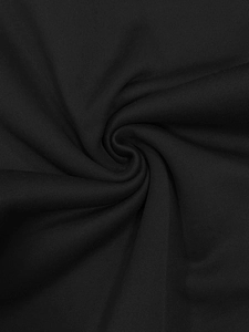 Macro shot of high-density black knit fabric texture showing softness and drape quality