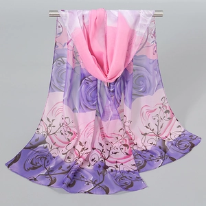 Detail of pink and purple peony floral print on lightweight translucent chiffon scarf