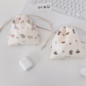 Detailed view of seersucker drawstring bags with cute elephant and bread dog cartoon prints