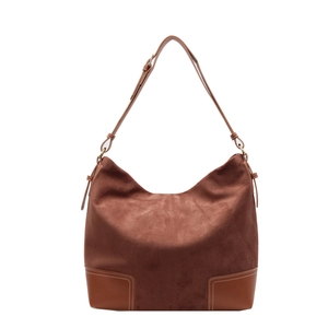 Brown vintage suede tote bag with leather patchwork and adjustable strap on white background