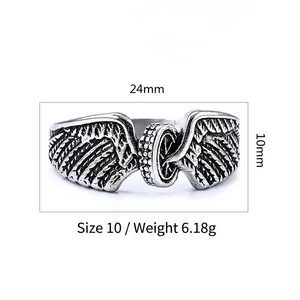 Macro view of vintage biker ring showing tire wheel and wing details with dimensions