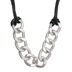 Close-up of polished silver chunky chain links paired with black braided rope cords