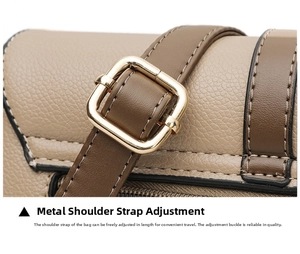 Close-up of adjustable golden buckle on brown lychee texture leather shoulder strap