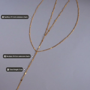 Double layered Y-shaped gold tassel necklace in stainless steel with sequin charms