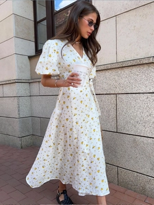 Floral print cotton dress with puff sleeves and waist tie for a summer look