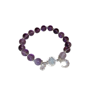 Vintage amethyst bead bracelet with silver star and zircon moon pendants on white background