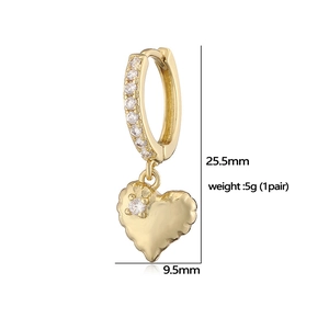 Detail view of gold heart earrings with white crystals and dimensions marking