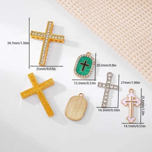 Cross pendant charms with zircons in gold and silver finish, showing various sizes