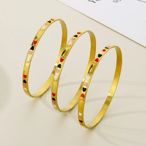 Three-piece stackable 18K gold-plated stainless steel bangles with colorful enamel hearts