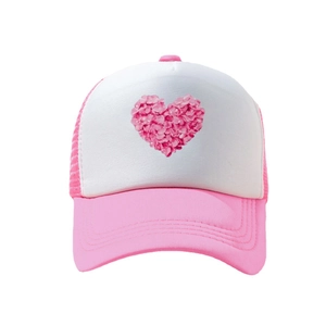 Pink and white mesh trucker hat for women featuring a floral heart print on the front crown