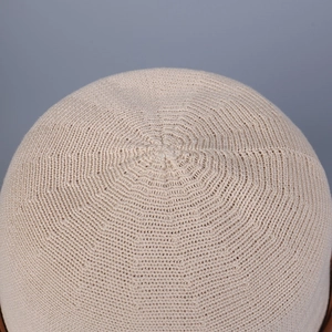 Close-up of beige knitted sun hat crown showing high-quality woven texture and detail