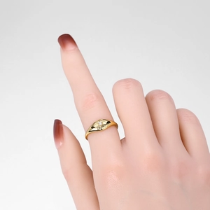 Close-up of a gold S925 silver flower ring with a sparkling white zircon center stone