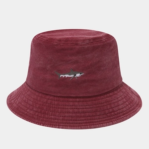 Detailed embroidery of a shark on the vintage burgundy washed cotton bucket hat