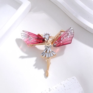 Detail of dragonfly fairy brooch with sparkling rhinestones and pink wings