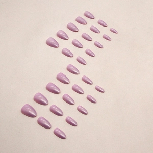 Glossy lavender almond-shaped press-on nails set in elegant minimalist layout