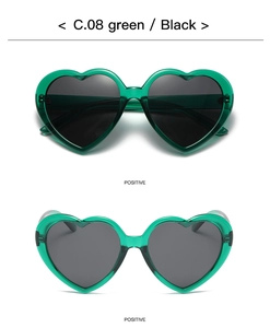 Front view of green transparent heart-shaped sunglasses with dark polarized lenses