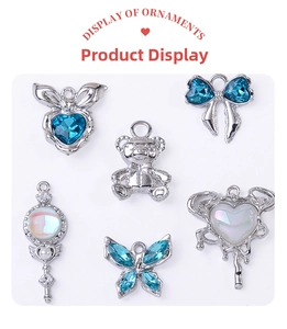 Detailed set of silver alloy DIY charms with blue gems including hearts and bows