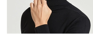 Close-up of the ribbed turtleneck collar and premium knit texture on this black sweater