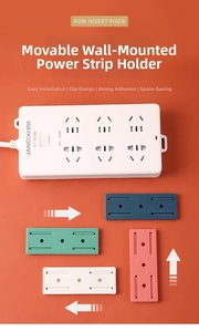 Detail view of colorful slide-out power strip fixers with adhesive wall mounting brackets