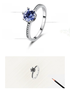 Detail of 925 sterling silver ring featuring a six-prong tanzanite blue zircon setting