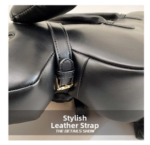 Macro detail of high-quality black leather handbag with a golden metal buckle strap