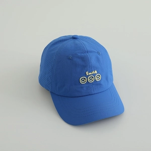 Detail of royal blue quick-dry kids baseball cap with smile embroidery and laser vents
