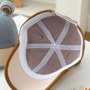 Cute bear-ear baby baseball cap with breathable mesh lining and 45-degree side view