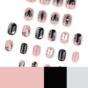 Gothic Y2K press-on nails set with pink and black heart patterns and silver stars