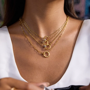 Luxurious layered gold titanium heart necklace with paperclip chain on model neck